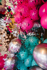Arch with colored glitters, balloons. Silver photo booth with decor shiny for party time. Zone with...