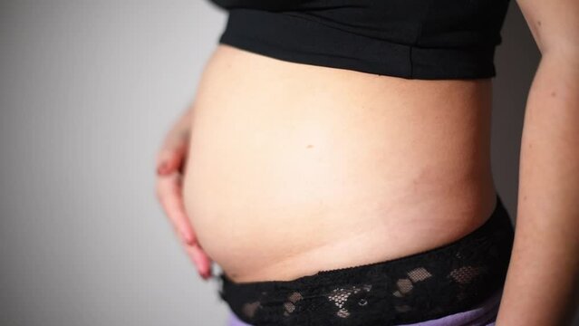 Women belly fat, postpartum belly front view video. Weight loss process