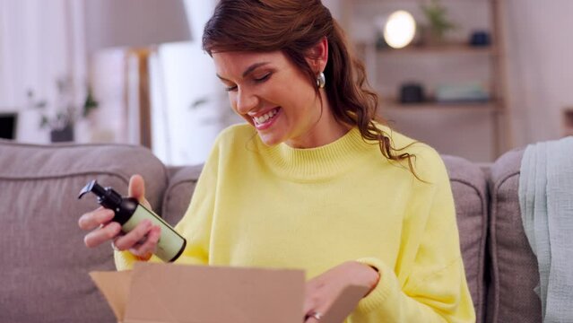 Happy woman, box and ecommerce delivery on sofa unpacking package, cargo or order in living room at home. Female customer smiling for delivered beauty products from online shopping purchase or parcel