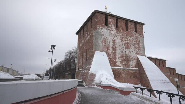 The brick wall of the Nizhny Novgorod Kremlin in winter. The brick tower of the Kremlin in Nizhny Novgorod. Dolly camera shot. 
