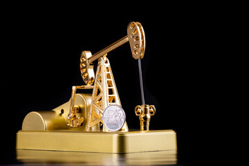 Golden oil pump and mint with the symbol of the Russian ruble on a black background