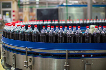 Beverage conveyor flowing with bottles