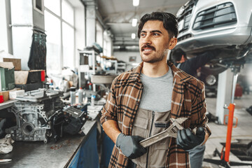 Portrait of a male mechanic in an auto repair shop