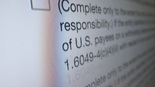 Tax form W-8IMY on the screen. Scrolling electronic tax form on the monitor