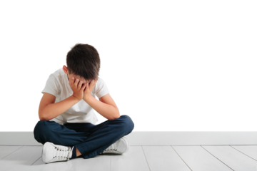 a child whose depression is sitting on the floor