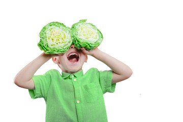 Happy cute boy is having fun played with green cabbage on png background. Bright photo of a boy....
