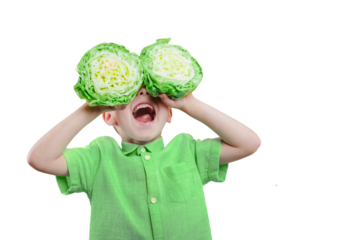 Happy cute boy is having fun played with green cabbage on png background. Bright photo of a boy. Colored panorama photo.
