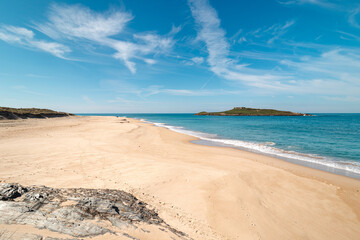 Walk along the Atlantic Ocean on the beach called Praia da Ilha do Pessegueiro near Porto Covo, western Portugal. Steps over Rota Vicentina