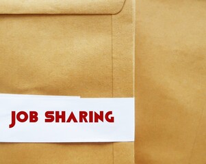Office envelope with text JOB SHARING, means two or more part-time workers perform the work of one full-time person, which is come back trend after pandemic