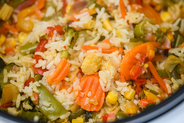 Top view of cooked risotto with vegetables.