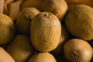 Concept of earth day, recycling and zero waste. Sweet kiwi in a reusable bag for fruits and...