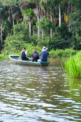 Touristic activities with the boat and tourist guide on Sandoval Lake in Puerto Maldonado Amazon Peru. 