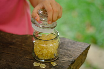 sugar cubes in a clear glass jar. Rock sugar has a sweeter level than granulated sugar, it can be...