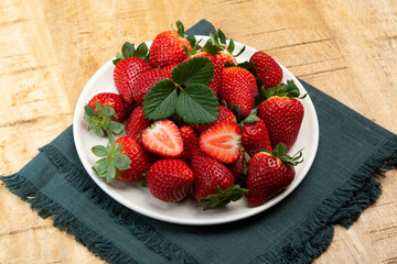 New harvest, board with fresh ripe red sweet Spanish strawberry