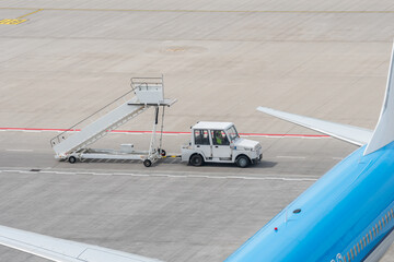 Passenger Stair Truck approaching an airplane
