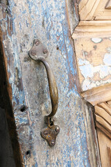 old rusty handle of wooden door