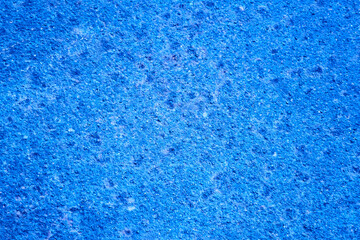 Fototapeta na wymiar Blue rustic stone textured wall backdrop. Abstract blank shabby wall.