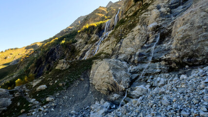 pretty mountain highland fast waterfall at summer day - photo of nature