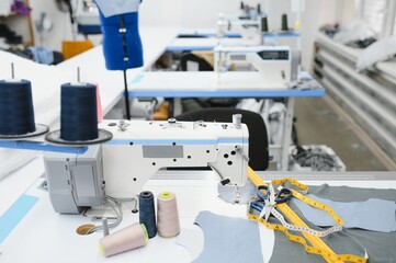 sewing supplies on the table next to the sewing machine