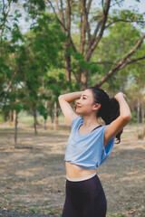 Young woman working out in early morning, practicing exercise, doing stretching out before running or jogging. Concept of healthy life, relaxation ,recreation. City life style. Body movement. warm up