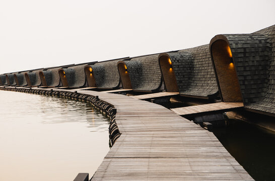 Architecture resort with shingel roof top floating on the river.