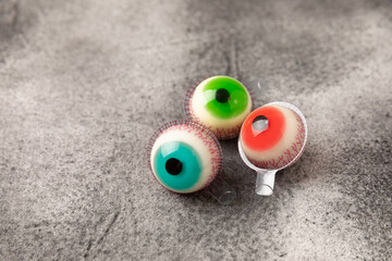 Halloween gummy eye candy on black background.Classic candy sweets for Halloween with.Halloween...