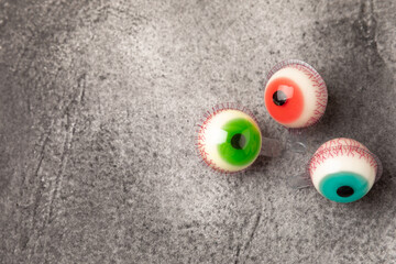 Halloween gummy eye candy on black background.Classic candy sweets for Halloween with.Halloween...
