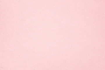 Old vintage pale pink paper surface texture close up