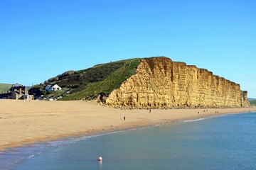 View along the beach and Jurassic Coast coastline, West Bay, Dorset, UK, Europe,