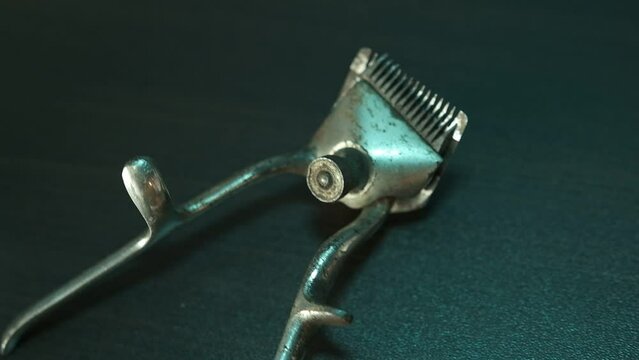 old hairdresser tools. two vintage hand-held hair clipper in corrosion