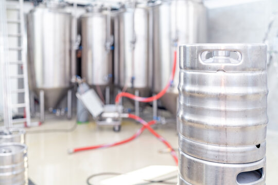 beer barrels with beer in a brewery