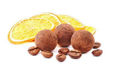Chocolate cocoa truffles candy sweets with orange and coffee beans isolated on white background.