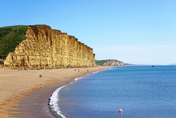 View along the beach and Jurassic Coast coastline, West Bay, Dorset, UK, Europe.