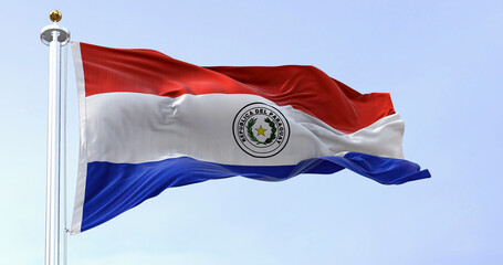 The national flag of Paraguay waving in the wind on a clear day