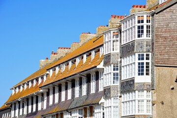 Row of apartments alongside the harbour, West Bay, Dorset, UK, Europe