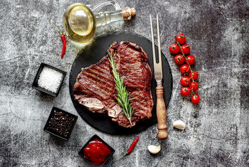 grilled T-bone steak on stone background