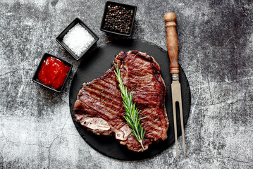 grilled T-bone steak on stone background