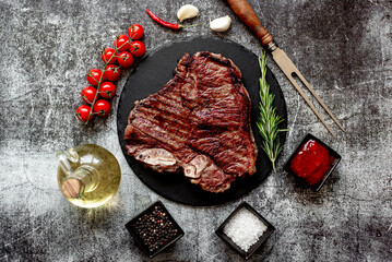 grilled T-bone steak on stone background