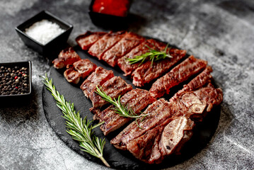 grilled T-bone steak on stone background