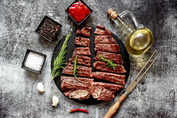 grilled T-bone steak on stone background