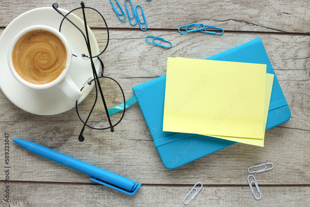 Poster blank notepad blue ready for layout. top view image of an open notebook with blank pages next to a c