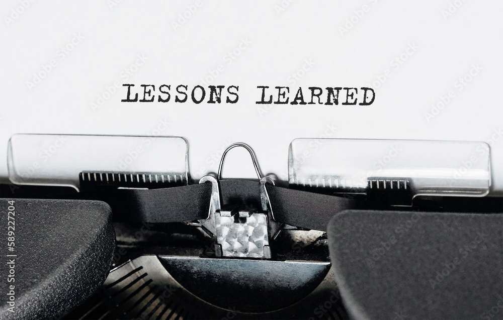 Poster text lessons learned typed on retro typewriter