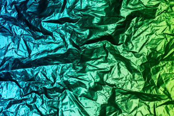 Metallic aqua green color scheme. Bicolor crumpled foil as the background texture