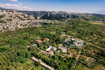 Fototapeta na wymiar Aerial view of the summer botanical garden in Yerevan, Armenia, with a blue sky