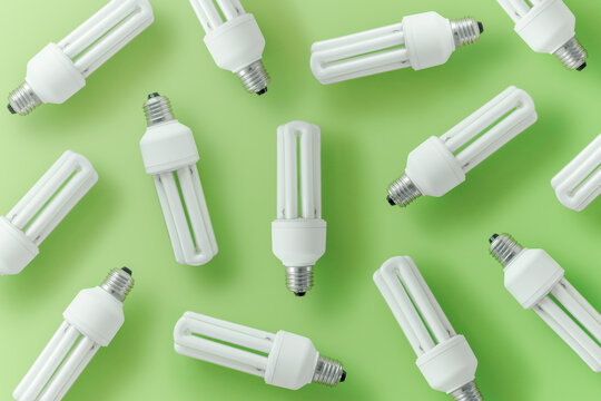 Collection of various light bulbs on green background