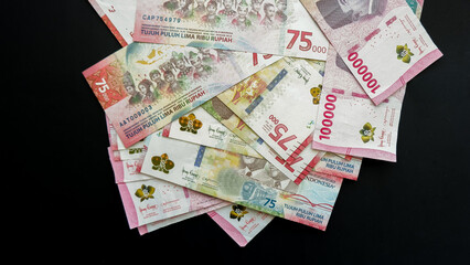 Indonesian rupiah note. Indonesian Rupiah the official currency of Indonesia. Business concept, Black Background. Uang Rupiah Indonesia. Bank Indonesia.