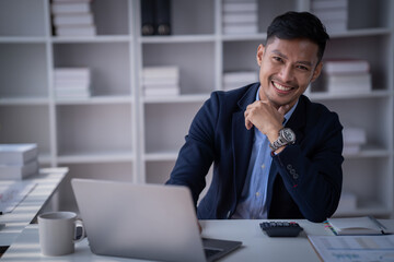 Portrait of Smiling business man at home office.