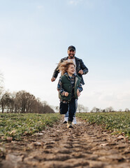 Father and son playing outdoors in spring
