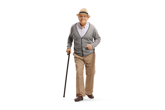 Full length portrait of an elderly man walking with a cane towards camera