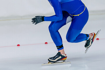 close-up male skaters run srint race in speed skating competition, winter sports games